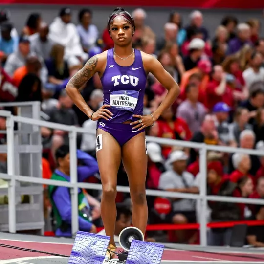 Indya Mayberry stands behind the starting blocks for the 200m race at the NCAA Indoor Championships