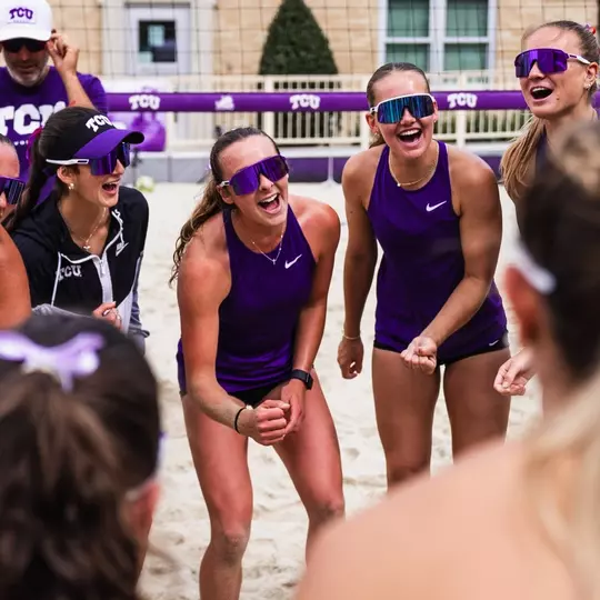 TCU beach volleyball team cheering