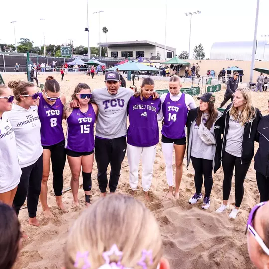 TCU beach volleyball team huddle