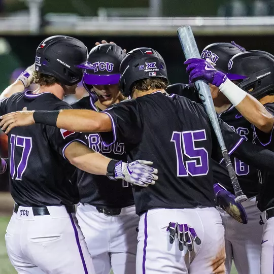 Rob Liddington celebrates his grand slam, hugging his teammates at home plate against Tarleton State on April 14, 2026.