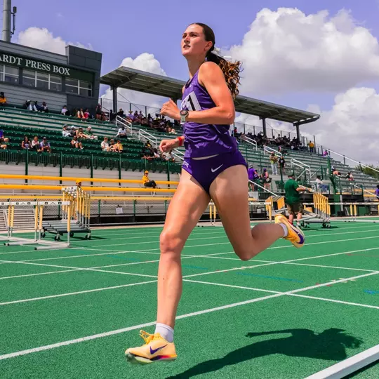 TCU track's Georgia Scott races down the track, passing the Markwardt Pressbox at Baylor's Clyde Hart Track & Field Stadium.