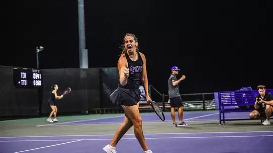 Jennifer Jackson celebrating after clinching the match against Texas Tech