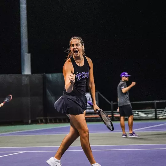 Jennifer Jackson celebrating after clinching the match against Texas Tech