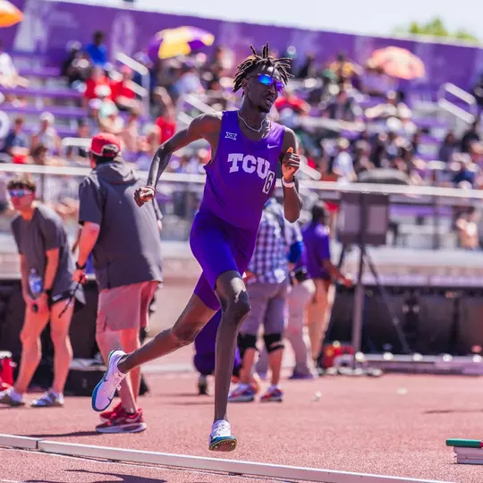 TCU Track's Mohamed Kowa runs around the track in the 1500m race.