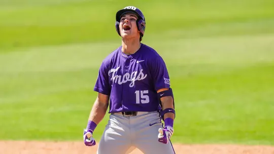Chase Brunson celebrates his go-ahead, two-run double at second base in a win over Baylor
