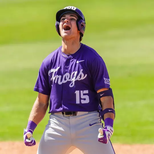 Chase Brunson celebrates his go-ahead, two-run double at second base in a win over Baylor