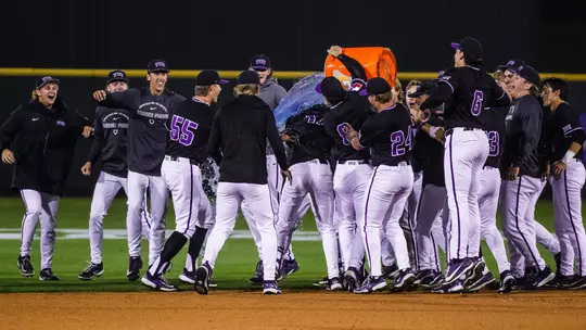 The TCU baseball team celebrates by pouring Gatorade over Rob Liddington after his game-winning hit.