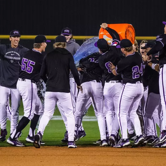 The TCU baseball team celebrates by pouring Gatorade over Rob Liddington after his game-winning hit.
