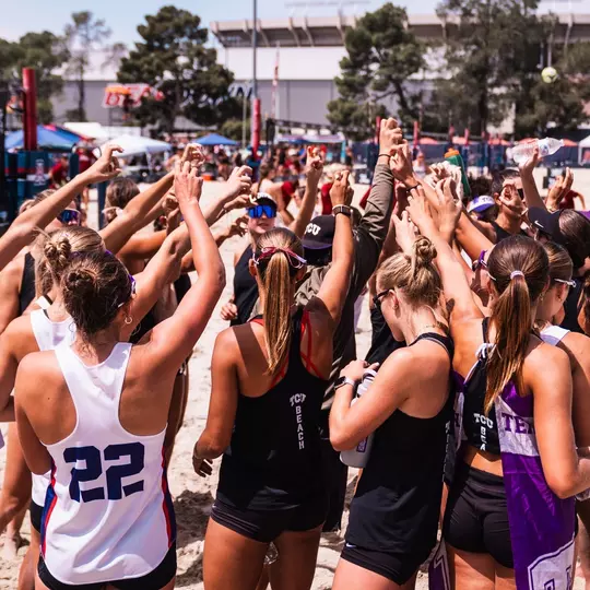 TCU beach volleyball team huddle