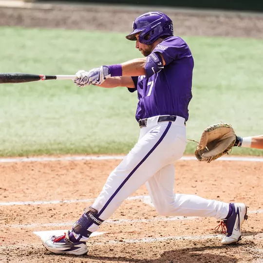 Cole Cramer swings at a pitch in a game against Houston.
