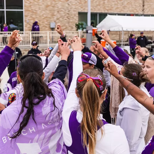 TCU beach volleyball team huddle