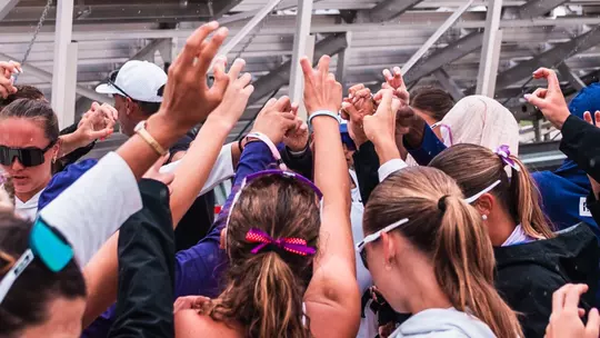 TCU Beach Volleyball team huddle