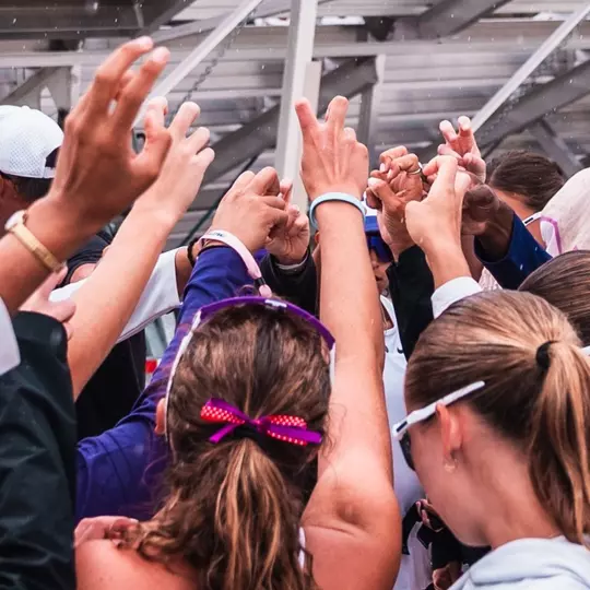 TCU Beach Volleyball team huddle