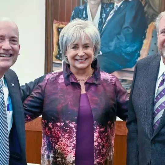 Mike and Brenda Harrison (right) with Chancellor Emeritus Victor Boschini
