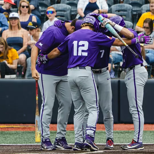 Kyuss Gargett greets teammates at home plate.