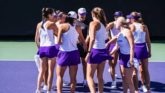TCU Women's Tennis huddle prior to match against Rice