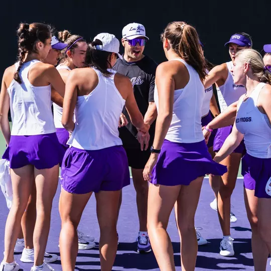TCU Women's Tennis huddle prior to match against Rice