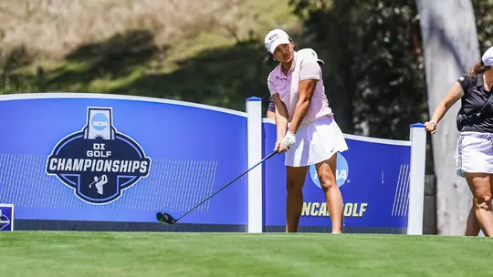 Kirstin Angosta lines up her tee shot at the NCAA D1 Women's Golf Championship.