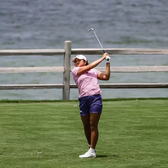 Kirstin Angosta follows through and tracks her ball following a tee shot.