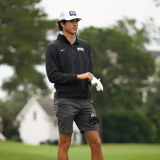 Sam Udovich stands and adjusts his glove before attempting a shot