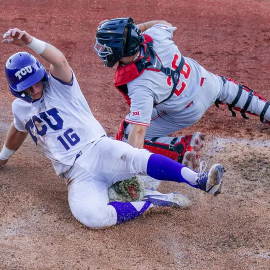 Nolan Traeger slides in safely at home plate.