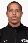 head shot of desmond bane in black shirt with white tcu logo