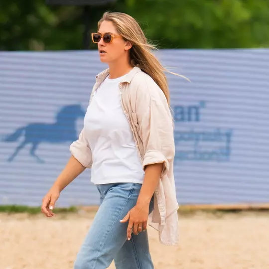 TCU Equestrian Assistant Courtney Line walking