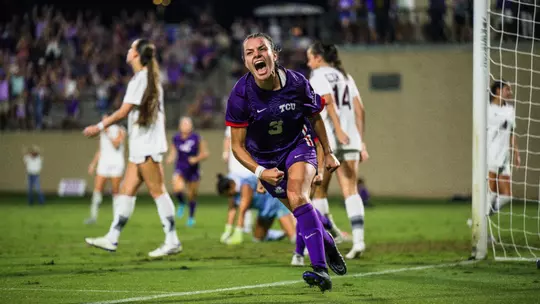 AJ Hennessey celebrating after scoring a game-winning goal against Texas A&M