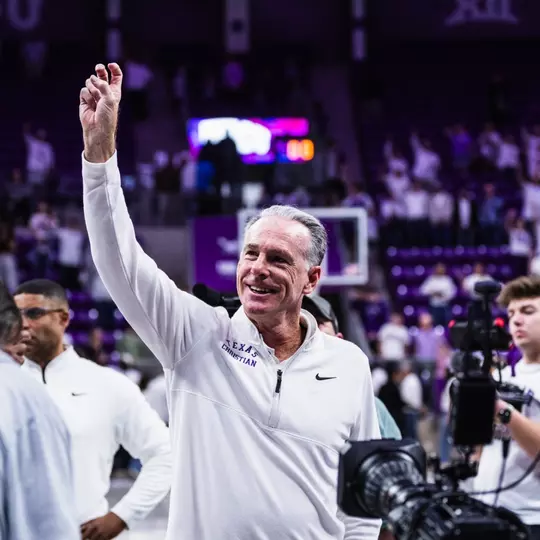 jamie dixon with his right hand frogs up