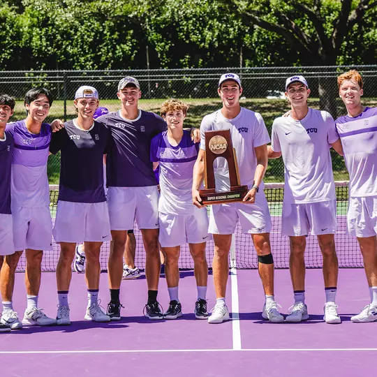 The TCU Men's Tennis team gathers with the NCAA Super Regional trophy following a 4-0 victory over Stanford.