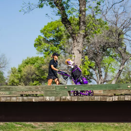 Camille Min-Gaultier pushes her golf cart during a round at Colonial Country Club/