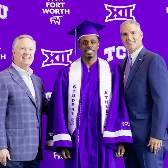 Jayden Pierre is shown with cap and gown at graduation