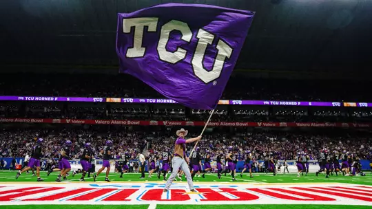 A TCU Ranger waves a TCU flag pregame at the Alamo Bowl