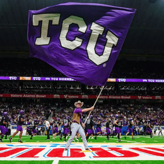 A TCU Ranger waves a TCU flag pregame at the Alamo Bowl