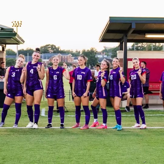TCU women's soccer starting XI against Alabama smiling at camera