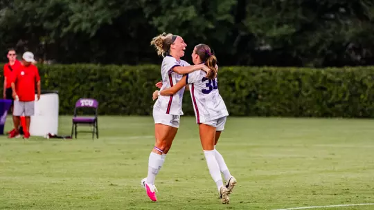 Bella Diorio and Evie Baker embracing after a goal in TCU's 3-2 win against Georgia