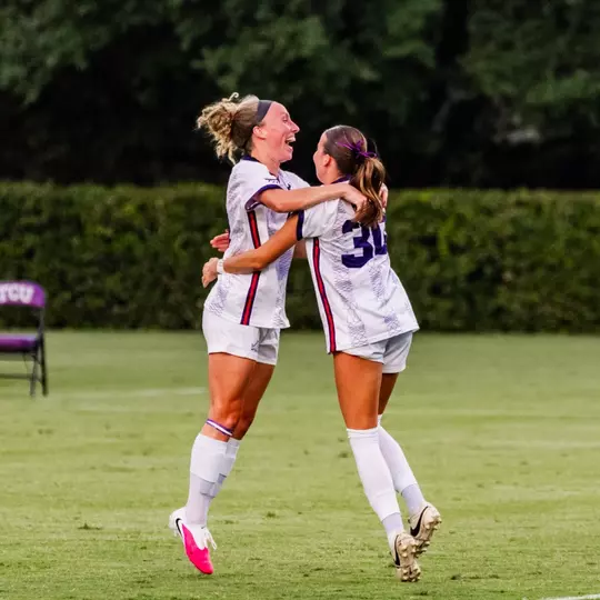 Bella Diorio and Evie Baker embracing after a goal in TCU's 3-2 win against Georgia
