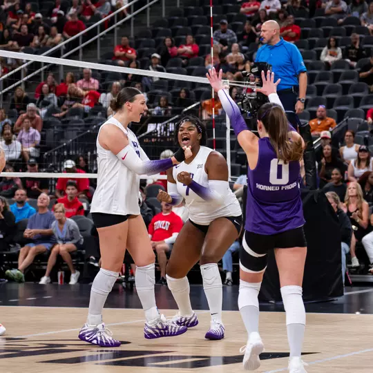 TCU volleyball's Kinsley Young and Reese Robins celebrate a point against UNLV