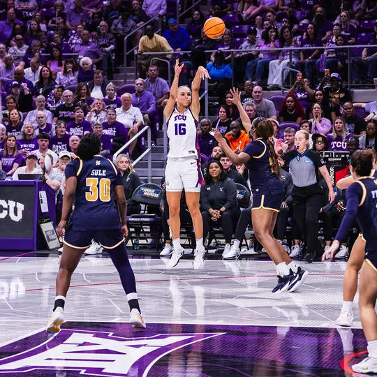Clara Bielefeld releases the basketball on a 3-point attempt.