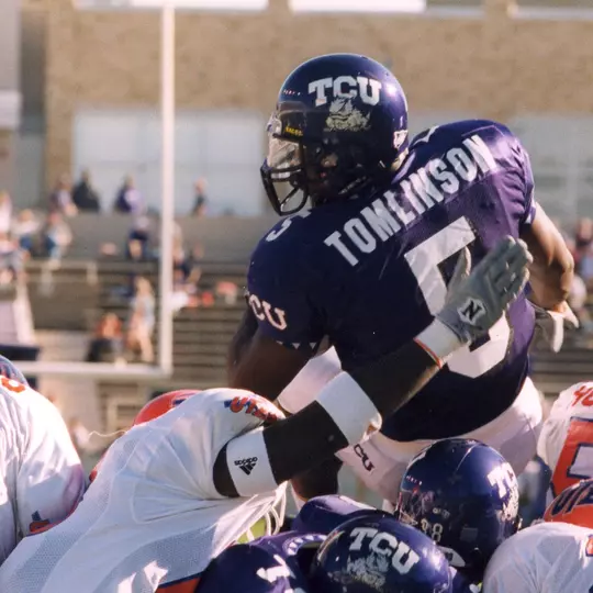 LaDainian Tomlinson diving over a pile of lineman