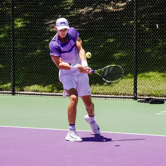 Cooper Woestendick connects on a backhand during an NCAA Super Regional match vs. Stanford