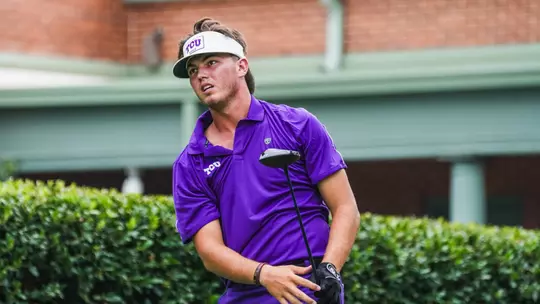 Cameron Kuchar watches the ball from the tee box