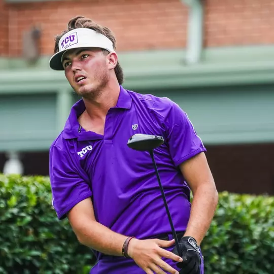 Cameron Kuchar watches the ball from the tee box