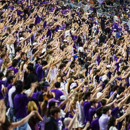Fans cheering at Amon G. Carter Stadium