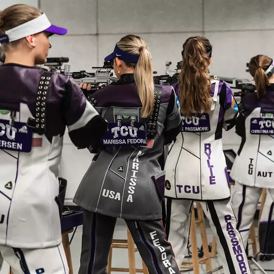 Five members of the TCU rifle team lineup on the firing line.