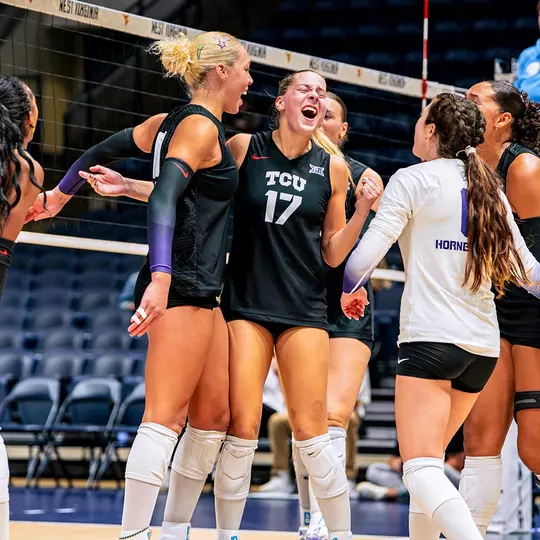 TCU Volleyball celebrates after scoring a point against WVU
