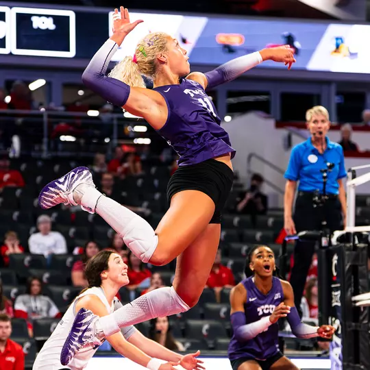 Becca Kelley jumps out of the back row to swing for a kill