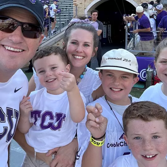 Heston Goggins and family on the field at a TCU Football Game