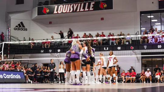TCU Volleyball huddles at Louisville