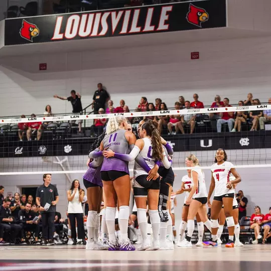 TCU Volleyball huddles at Louisville